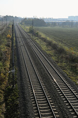 Fototapeta na wymiar Electrified railway line near Brno, Czech Republic, in foggy morning