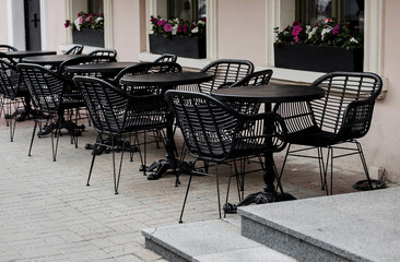 empty outdoors tables and chairs