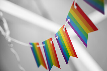 A garland of lgbt national flags on an abstract blurred background