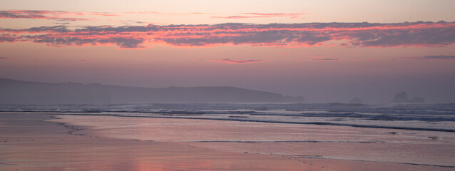 Fototapeta na wymiar Sunset in Valdearenas Beach, Cantabria, Spain