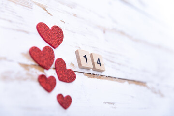 decoration for February 14th. red hearts and wooden numerals background forvalentine's day