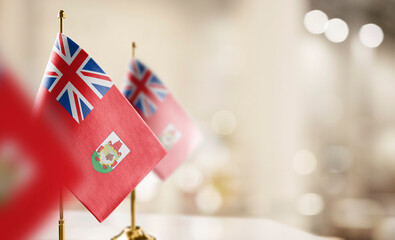 Small flags of the Bermuda on an abstract blurry background