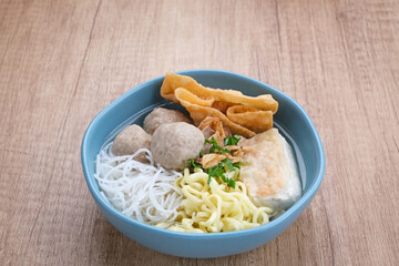 Bakwan Malang or Bakso Malang, traditional food from Malang, East Java, Indonesia. Meatballs soup served with noodles, tofu and fried dumpling (pangsit)
