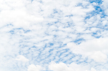 Beautiful white fluffy clouds in blue sky. Nature background from white clouds in sunny day