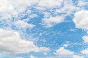 Beautiful white fluffy clouds in blue sky. Nature background from white clouds in sunny day