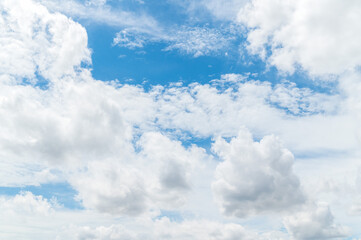 Beautiful white fluffy clouds in blue sky. Nature background from white clouds in sunny day