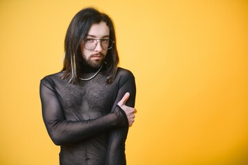 Portrait of a gay man on a colored background. Gender equality. The concept of the LGBT community....
