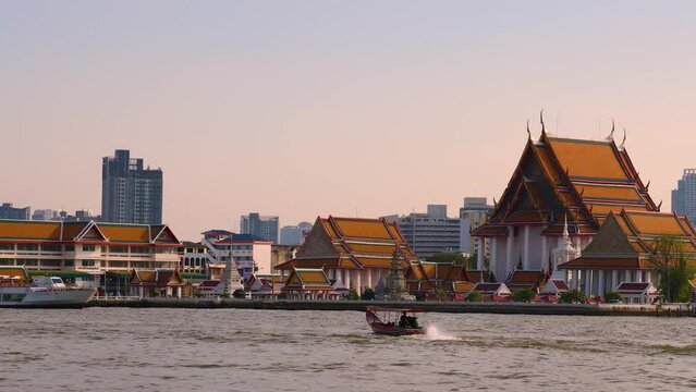 Bangkok, Thailand. December 29, 2022. Wat Kalayanamit Woramahawihan, Zoom out of  riverside temple in Bangkok.