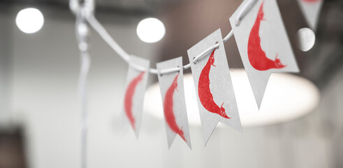 A garland of Easter Island national flags on an abstract blurred background