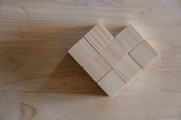wooden cube with heart sign icon on and copy space. Valentine love season concept.