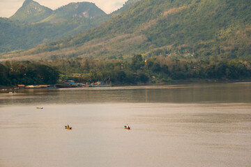 Beautiful wallpaper mekong river in Laos and Thailand. Roundtrip Asia. In the background the nature of Luang Prabang