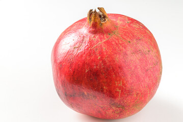 Ripe pomegranate isolated on white background