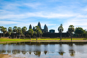 Fototapeta na wymiar Travel to the beautiful Angkor Wat in Siem Reap in Cambodia. Trees and Temple. Asia Roundtrip (Buddha)