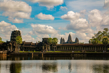 Fototapeta na wymiar Travel to the beautiful Angkor Wat in Siem Reap in Cambodia. Trees and Temple. Asia Roundtrip (Buddha)
