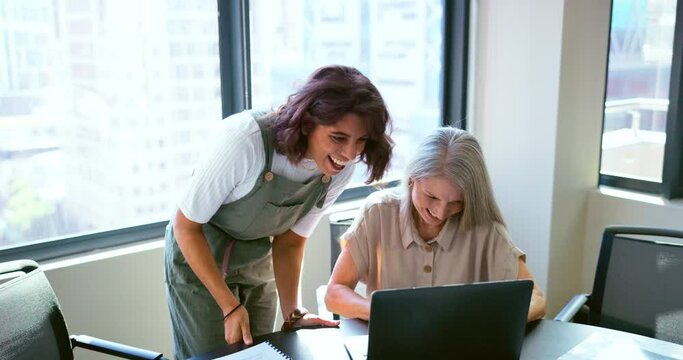 Success, handshake and business women with a laptop, celebrate win and email motivation. Fist bump, teamwork and excited employees reading communication on a computer with a partnership celebration