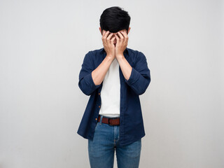 Asian man stand gesture close his face feels headache and depressed isolated
