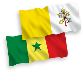 National vector fabric wave flags of Republic of Senegal and Vatican isolated on white background. 1 to 2 proportion.