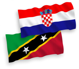 National vector fabric wave flags of Federation of Saint Christopher and Nevis and Croatia isolated on white background. 1 to 2 proportion.