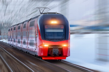 Naklejka premium Railway track turn motion blur effect against winter snowy weather. Travel, railway tourism. Blurred railway.