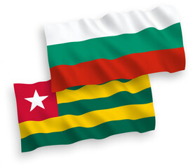 Fototapeta premium National vector fabric wave flags of Bulgaria and Togolese Republic isolated on white background. 1 to 2 proportion.