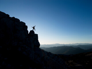 Naklejka na ściany i meble rope descent from cliff cliff and spectacular mountain ranges