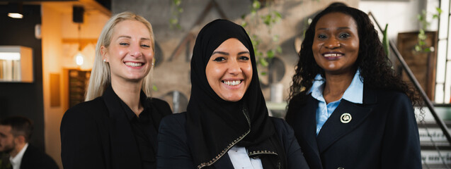 Horizontal Banner or header Portrait of three elegant women with different ethnicity smiling looking at camera.