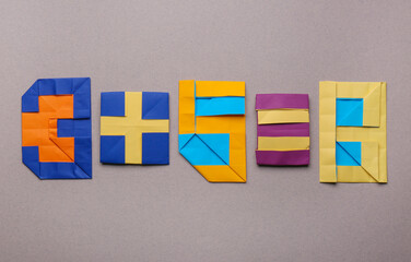 Mathematical operation, addition - three plus five equals eight. Numbers made of paper on light...