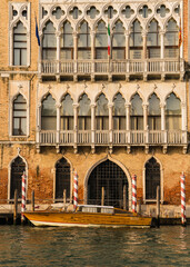 Charming architectural detail of buildings by the grand canal in Venice, Italy