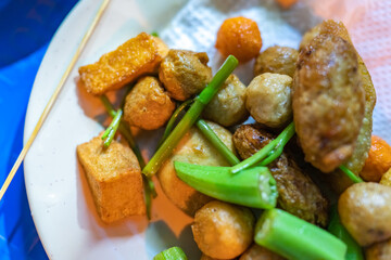 close-up Vietnamese food. Delicious homemade fried fish balls on table. popular street food of vietnam. Selective focus