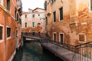 Fototapeta na wymiar Detail of an old brick bridge in Venice, Italy