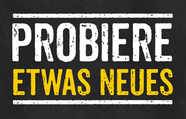  Tafel mit dem Text Probiere etwas Neues