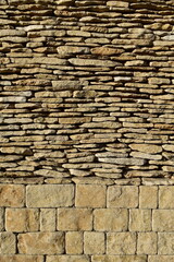 view of natural stone wall on a sunny day