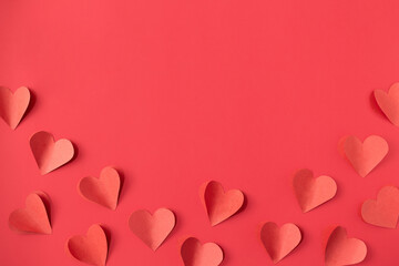 Valentine's day background with red and pink hearts like balloons on red background, flat lay