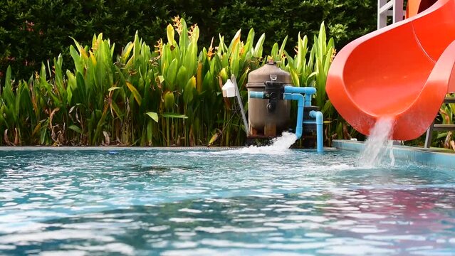 Water slides flowing water pumps by the pool