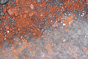 Crumbled pieces of terracotta and gravel background and wallpaper texture