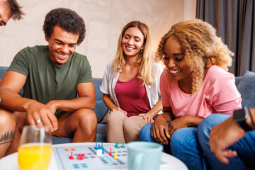 Friends having fun playing ludo
