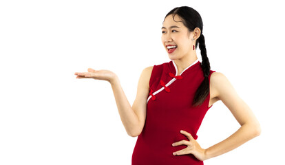 Chinese girl in red traditional dress posing hand pointing to your text on white background.