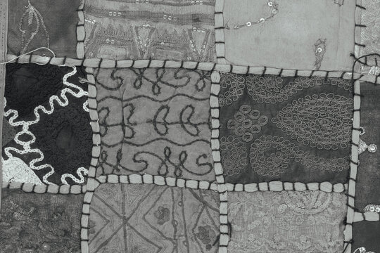 Detail old patchwork carpet. Black and white. Closeup
