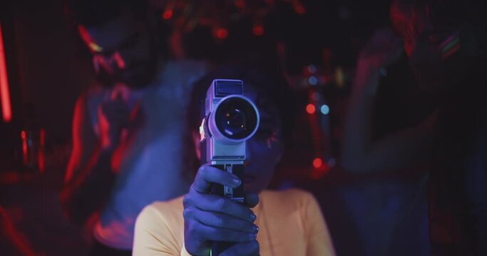 Person uses vintage camera to make video of friend dancing