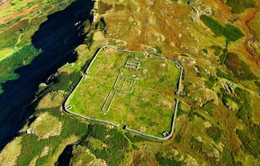 Hardknott Roman Fort Mediobogdum on Hardknott Fell. Lake District National Park, Cumbria. Aerial looking north. Terrain drops left into Upper Eskdale