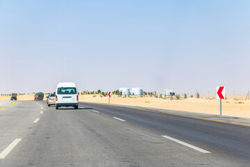 traffic on highway in middle of desert