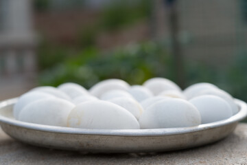 Duck eggs in the metal plate.
