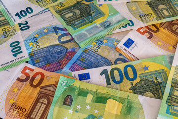 concept background of colorful euro cash banknotes close up , money backdrop for design