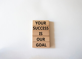 Your success is our goal symbol. Wooden blocks with words Your success is our goal. Beautiful white background. Business and Your success is our goal concept. Copy space
