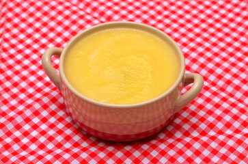 italian dish of polenta cornmeal in a bowl close-up