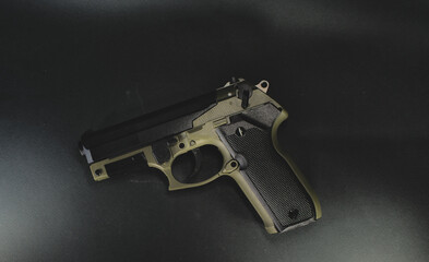 Air gun black and green on a black background