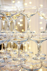 Pyramid of glasses champagne on party. Champagne tower.