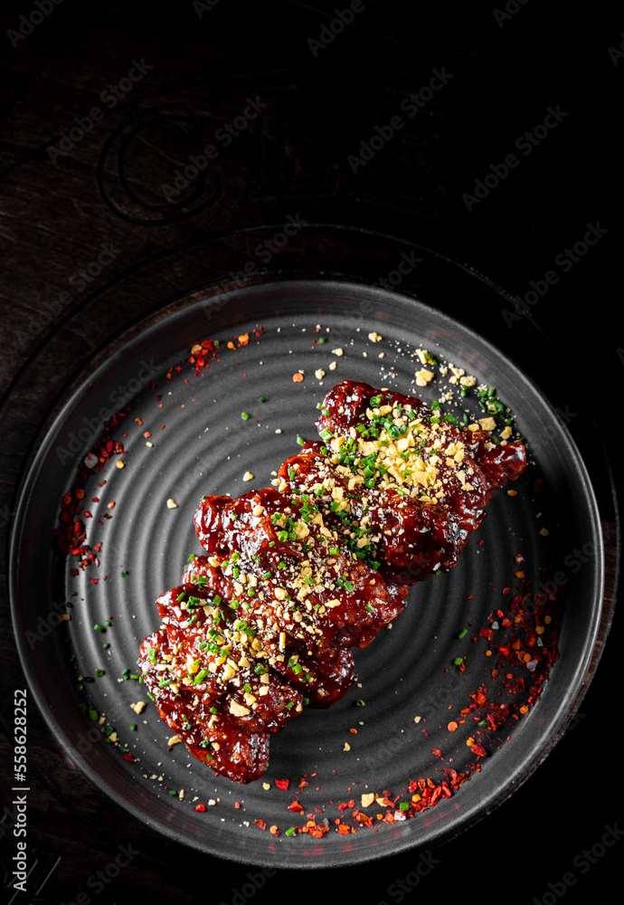 Wall mural fried bbq chicken wings in plate