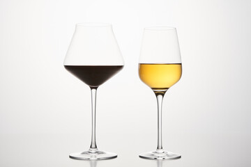 Various shapes of wineglasses with red, white wine.