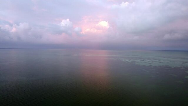 Drone view of the beach Water island with purple sky. ocean stock clips.